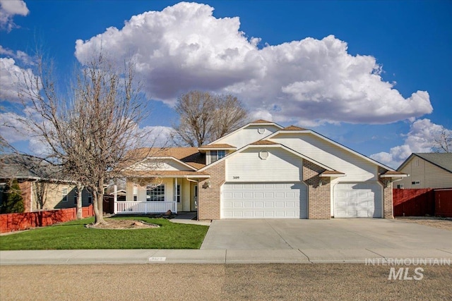 view of front of house featuring a front yard and a garage