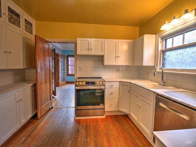 kitchen with white cabinetry, sink, dark hardwood / wood-style flooring, and stainless steel appliances