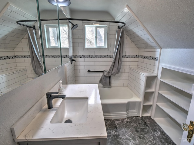 bathroom featuring vanity and tiled shower / bath combo