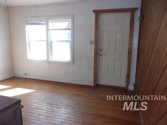 entryway with hardwood / wood-style flooring