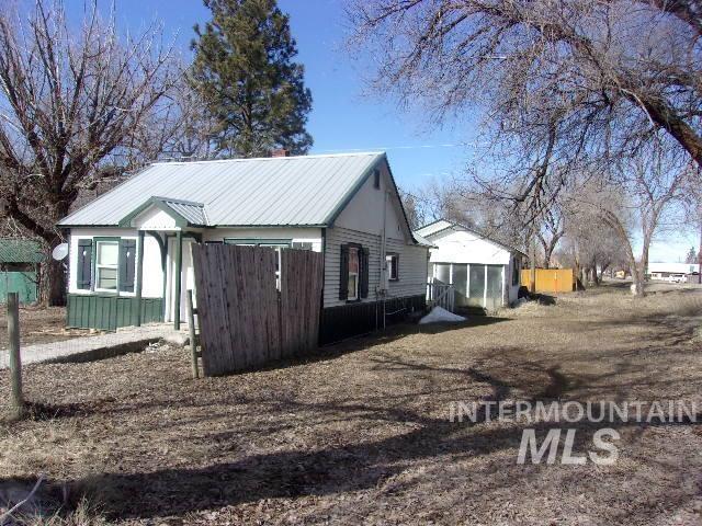 view of property exterior featuring metal roof