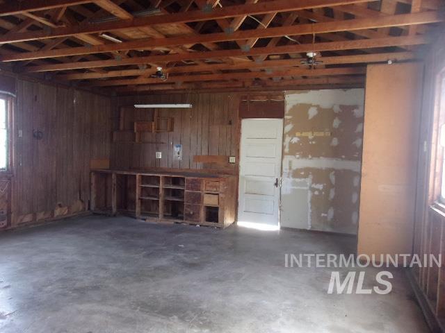 garage featuring wooden walls