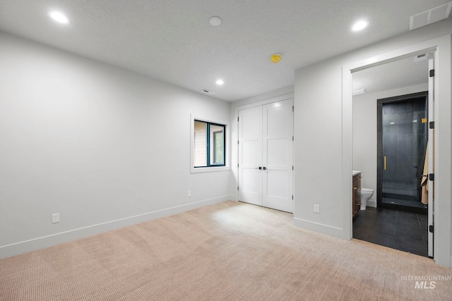 1010 Elo Rd, Mccall, ID 83638 - unfurnished bedroom featuring carpet flooring, recessed lighting, a closet, and ensuite bath