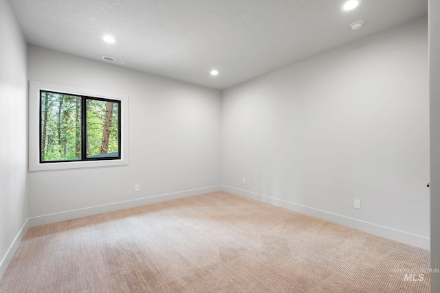1010 Elo Rd, Mccall, ID 83638 - unfurnished room with light colored carpet, recessed lighting, and a smoke detector