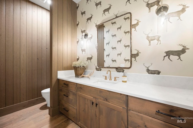 1010 Elo Rd, Mccall, ID 83638 - bathroom featuring vanity, wood finished floors, and wood walls