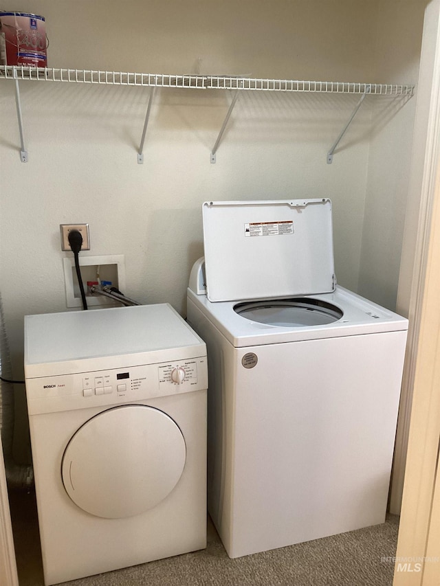 laundry room with independent washer and dryer