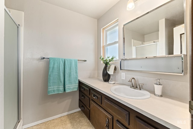 bathroom featuring vanity and walk in shower