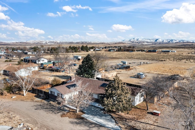 drone / aerial view featuring a mountain view