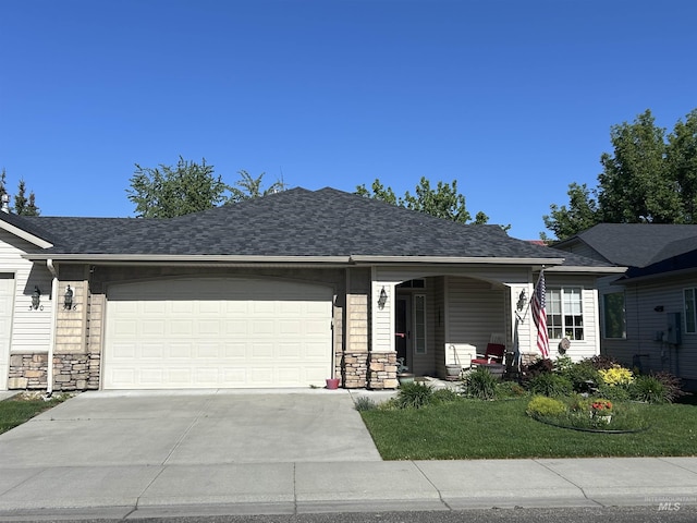 336 S Golden Eagle Ln, Eagle, ID 83616 - ranch-style home featuring concrete driveway, a porch, a garage, and stone siding