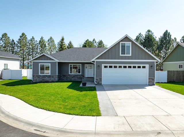 craftsman inspired home featuring fence, stone siding, and a front lawn