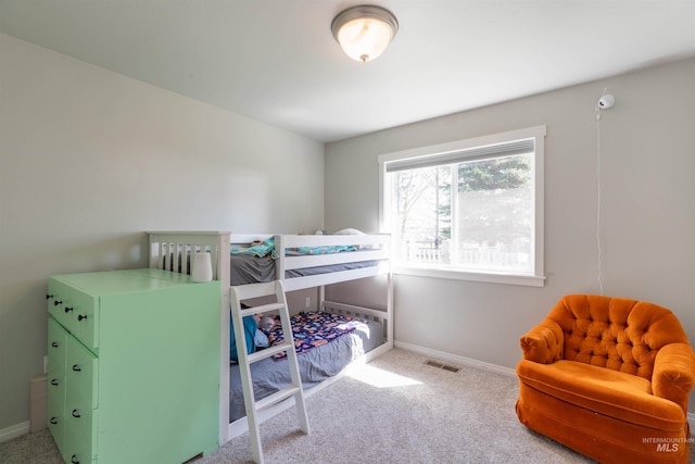 bedroom with baseboards, carpet, and visible vents