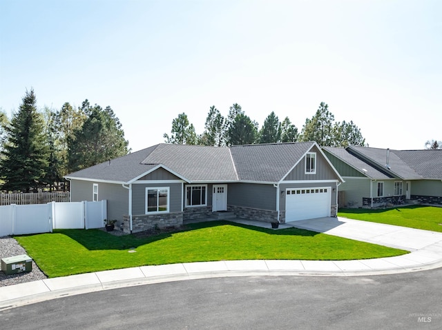 view of front of house featuring fence, a front yard, and stone siding