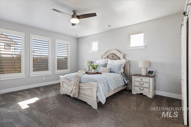 300 S Adventure Way, Kuna, ID 83634 - bedroom with dark carpet, baseboards, and a ceiling fan