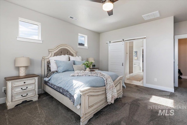300 S Adventure Way, Kuna, ID 83634 - carpeted bedroom with a barn door, ensuite bath, baseboards, and ceiling fan