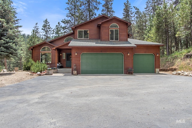 16 Meadow Ln, Boise, ID 83716 - view of front facade with asphalt driveway, a shingled roof, and a garage