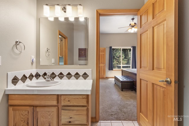 16 Meadow Ln, Boise, ID 83716 - bathroom with vanity, ceiling fan, tile patterned flooring, and tasteful backsplash