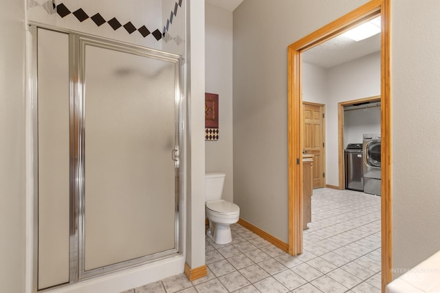 16 Meadow Ln, Boise, ID 83716 - bathroom featuring a shower stall, tile patterned floors, and washing machine and dryer