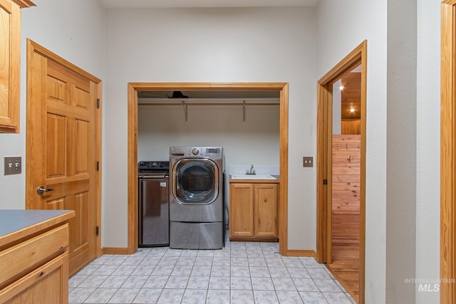 16 Meadow Ln, Boise, ID 83716 - laundry room featuring light tile patterned floors, cabinet space, and separate washer and dryer