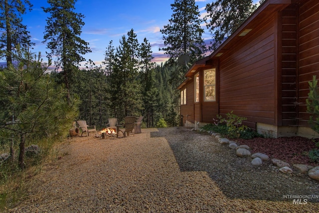 16 Meadow Ln, Boise, ID 83716 - yard at dusk featuring an outdoor fire pit