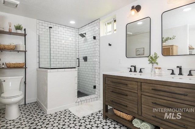 full bathroom featuring tile patterned floors, visible vents, a sink, and a stall shower
