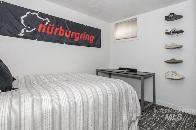 bedroom featuring baseboards