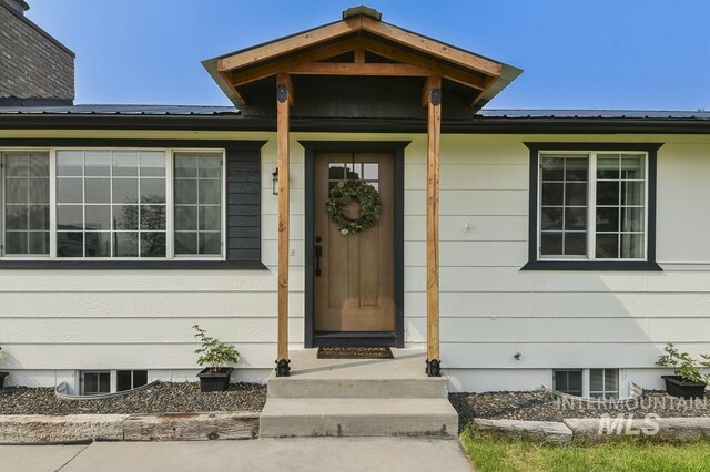 property entrance with metal roof
