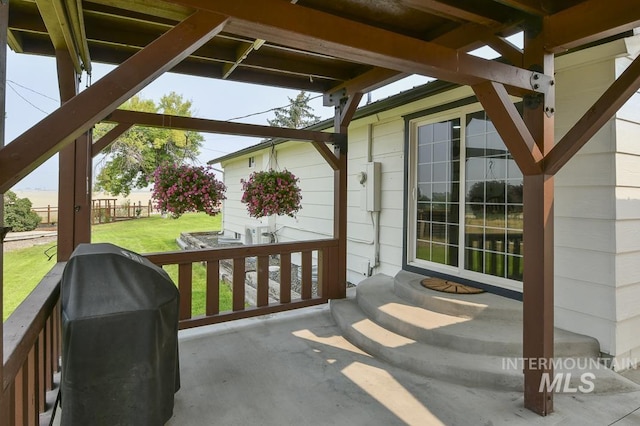 view of patio featuring grilling area and entry steps
