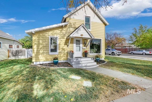 view of front of property with a front lawn