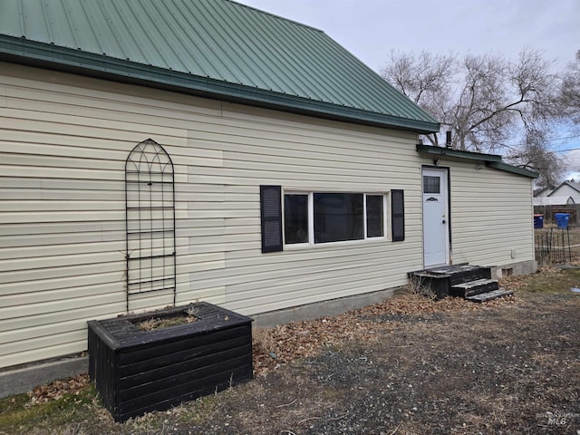 rear view of house with metal roof