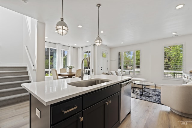 386 E Presidio Ln, Eagle, ID 83616 - kitchen with a sink, dishwasher, open floor plan, recessed lighting, and light wood-style floors