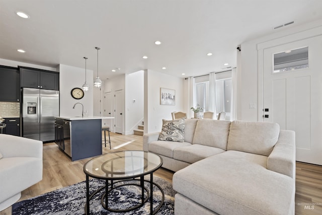 386 E Presidio Ln, Eagle, ID 83616 - living room with light wood-type flooring, stairway, and recessed lighting