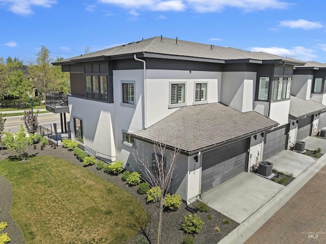 386 E Presidio Ln, Eagle, ID 83616 - view of side of property with stucco siding, concrete driveway, and a balcony