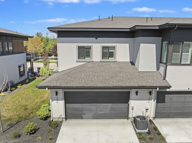 386 E Presidio Ln, Eagle, ID 83616 - view of property exterior featuring a shingled roof, concrete driveway, stucco siding, and central air condition unit