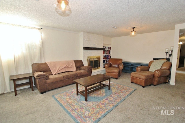 carpeted living room with a textured ceiling and a brick fireplace