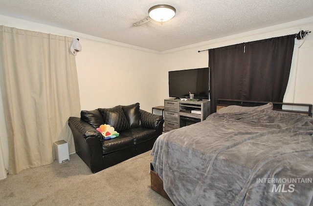 carpeted bedroom featuring a textured ceiling