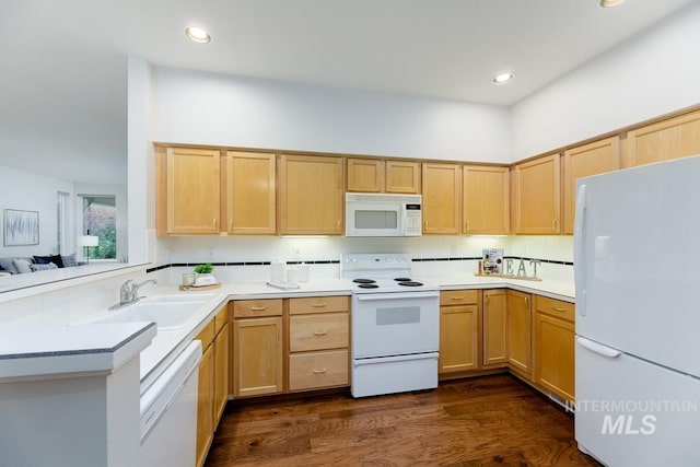 kitchen featuring kitchen peninsula, light brown cabinetry, dark hardwood / wood-style flooring, white appliances, and sink