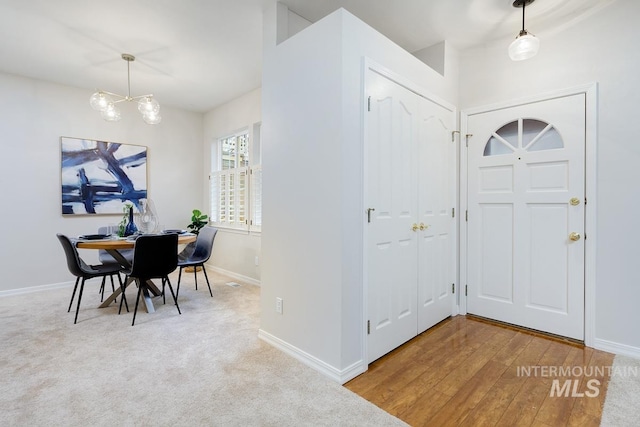 entrance foyer with a chandelier and hardwood / wood-style flooring