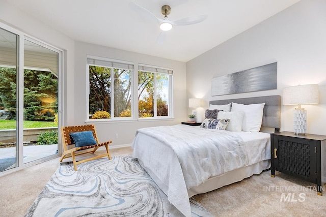 bedroom with ceiling fan, access to exterior, and light colored carpet