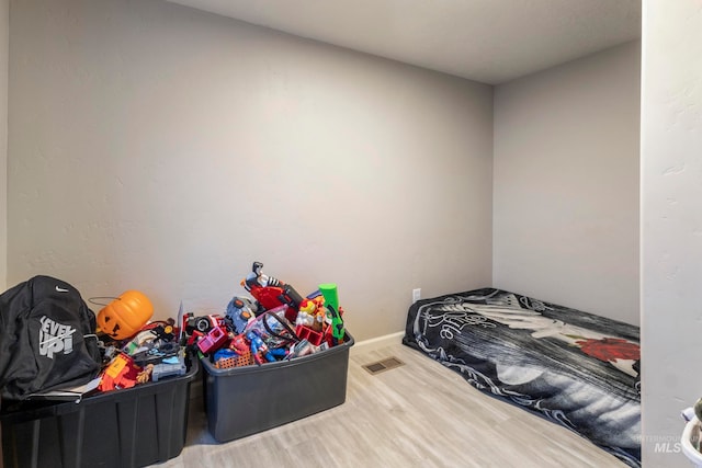 bedroom featuring wood-type flooring