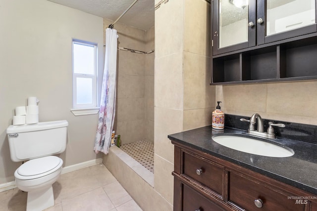 bathroom featuring tile patterned floors, a shower with curtain, toilet, and vanity