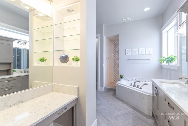 2527 E Taormina Dr, Meridian, ID 83642 - bathroom with a bath, vanity, and a walk in shower