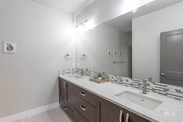 2527 E Taormina Dr, Meridian, ID 83642 - full bathroom with double vanity, tasteful backsplash, and baseboards