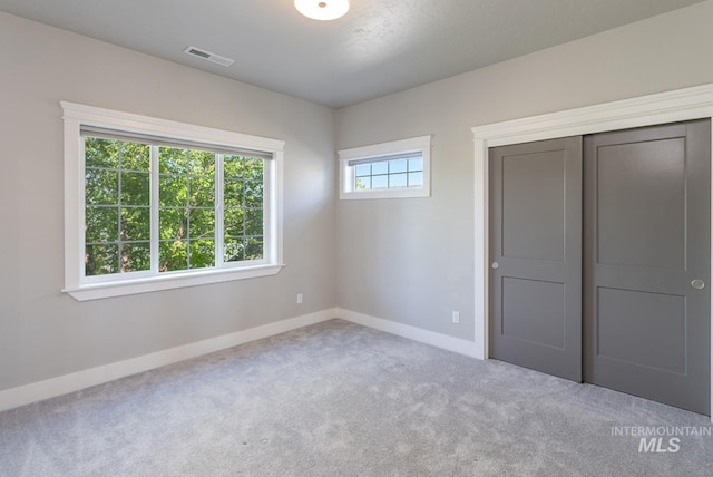 2527 E Taormina Dr, Meridian, ID 83642 - unfurnished bedroom with carpet floors, baseboards, and a closet