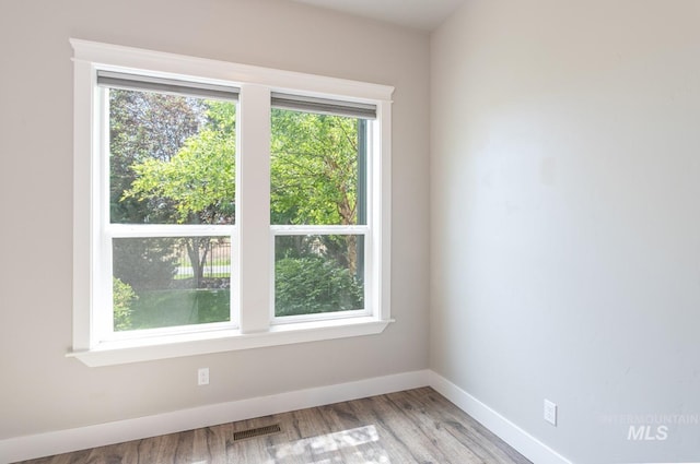 2527 E Taormina Dr, Meridian, ID 83642 - spare room featuring baseboards and wood finished floors