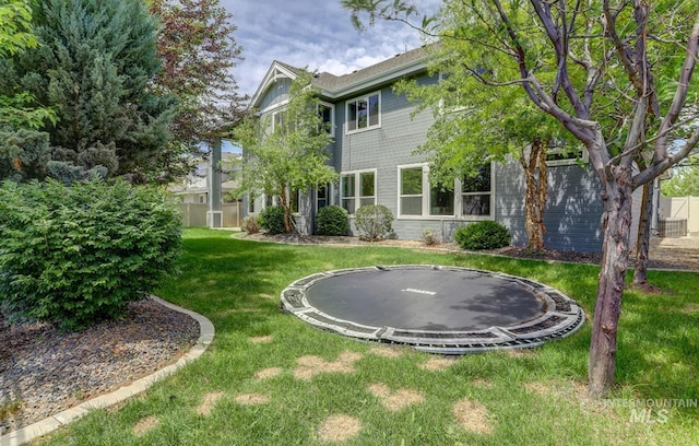 2527 E Taormina Dr, Meridian, ID 83642 - view of grassy yard with a trampoline