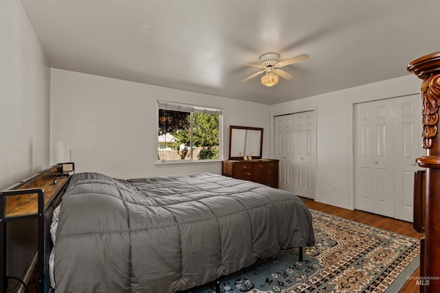 510 Shady Grove Way, Kuna, ID 83634 - bedroom featuring wood finished floors, multiple closets, and ceiling fan