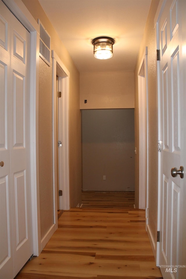 hallway featuring light hardwood / wood-style flooring