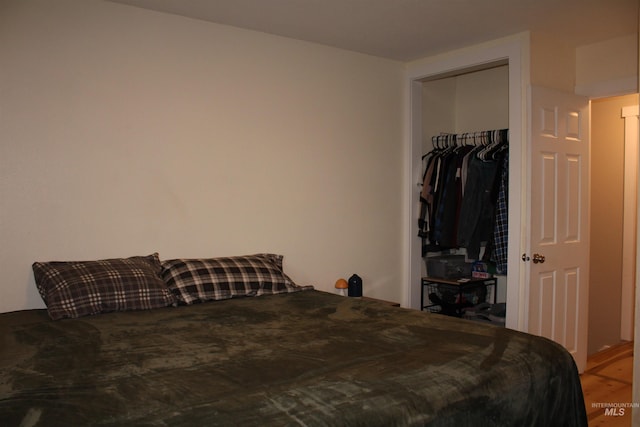 bedroom featuring a closet and hardwood / wood-style flooring