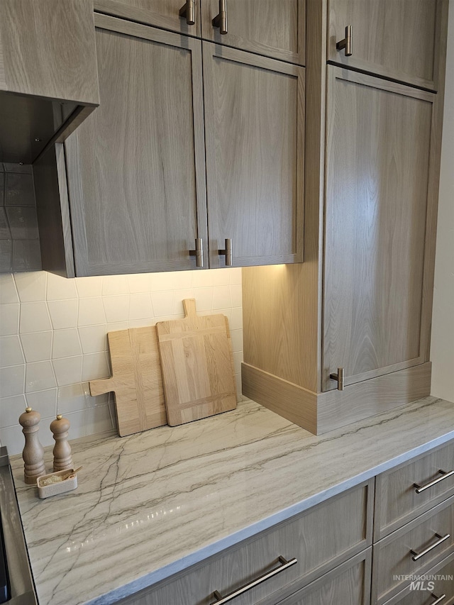 bathroom featuring tasteful backsplash