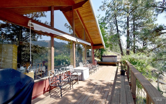 wooden deck featuring area for grilling